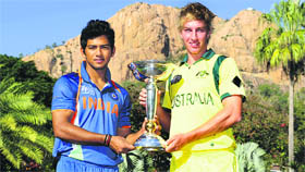 Indian skipper Unmukt Chand and William Bosisto of Australia pose with the trophy.