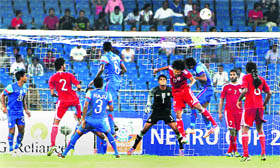 Indian and Maldives players vie for the ball during their Nehru Cup match in New Delhi on Saturday.