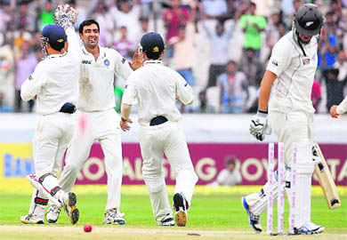 Ravichandran Ashwin celebrates the wicket of New Zealand captain Ross Taylor on the fourth day of the first Test in Hyderabad on Sunday. Ashwin�s match figures of 12/85 are the best against New Zealand by any Indian bowler.  