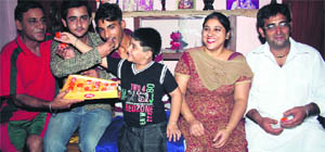 Prashant�s family members celebrate India�s success in Faridkot on Sunday. 