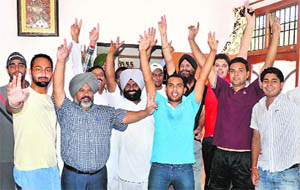 Family members of Sandeep Sharma in cheerful mood in Patiala on Sunday. 