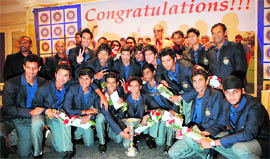 The India Under-19 World Cup winning team strikes a pose during a felicitation ceremony in Mumbai on Tuesday.