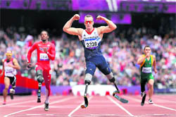 Britain's Richard Whitehead celebrates after winning the men's 200m T42 final race at the 2012 Paralympics in London on Saturday. 