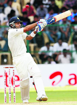 Virat Kohli pulls one to the boundary on Monday. 