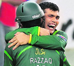 Kamran Akmal celebrates with Abdul Razzaq. � Reuters
