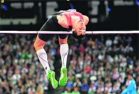 Germany's Reinhold Boetzel competes in the men's high jump F46 final during the 2012 Paralympic Games at the Olympic Stadium in London on Saturday