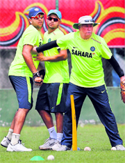 Indian coach Duncan Fletcher in a playful mood with Yuvraj Singh and Suresh Raina in Colombo on Thursday.