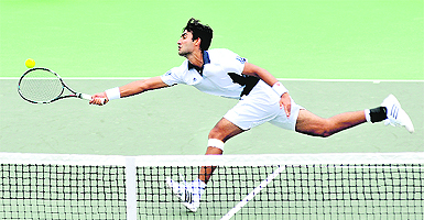Yuki Bhambri stretches to hit a forehand to Daniel King Turner at the CLTA Stadium in Chandigarh on Friday.