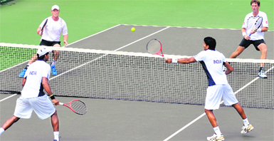 Divij Sharan volleys as Vishnu Vardhan watches during the doubles match against New Zealand in Chandigarh on Saturday. � Tribune photo: Pradeep Tewari