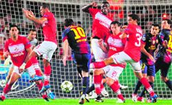 Barcelona�s Lionel Messi takes a free kick against Spartak Moscow in Barcelona on Wednesday. Barca won 3-2 � AFP