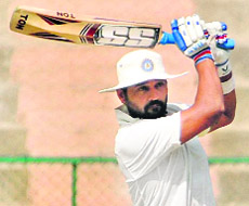 Murali Vijay hits a four during his knock of 266 in Bangalore. 