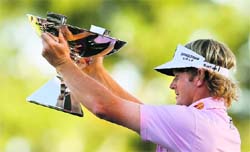 Brandt Snedeker poses with the FedExCup after his three stroke victory at the Tour Championship at East Lake Golf Club on Sunday.