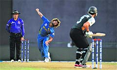 Sri Lanka's Lasith Malinga bowls to New Zealand's Ross Taylor during their Super Eights match in Pallekele on Thursday. 