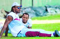 While Michael Hussey (L) kept slogging in the nets, Chris Gayle chose to let his hair down for a while after practice in Colombo
