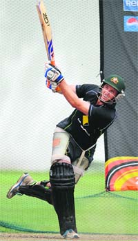 Australia�s Michael Hussey (L) slogs in the nets ahead of their semifinal tie in Colombo