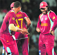 Chris Gayle hits a six during the semifinal against Australia (L) and later dances to celebrate the win in Colombo on Friday. �AFP/ Reuters 