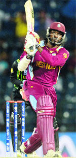 Chris Gayle hits a six during the semifinal against Australiaon Friday. �AFP/ Reuters