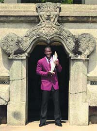 West Indies skipper Darren Sammy poses with the trophy at the Independence Memorial Hall in Colombo on Monday