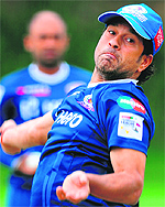 Sachin Tendulkar of Mumbai Indians bowls durings net practice in Johannesburg in preparation for the Champions League T20 tournament
