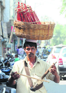 A man sells handmade sarangis in Karnal. 