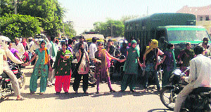 Agitating girl students block traffic on Delhi road in Rewari. 