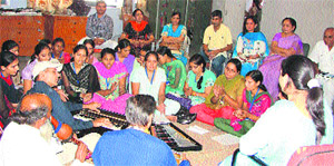 Participants attend a music session at a five-day workshop on multi-art at Arya Kanya Mahavidhalya, Shahabad. 