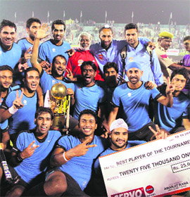 The jubilant Indian Oil team after winning the Surjit Singh Memorial Hockey Tournament in Jalandhar on Friday. Indian Oil beat Bharat Petroleum 4-3 to take the title. 