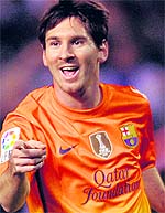 Lionel Messi celebrates yet another goal during Barcelona�s 5-4 win over Deportivo in Coruna, Spain, on Saturday night