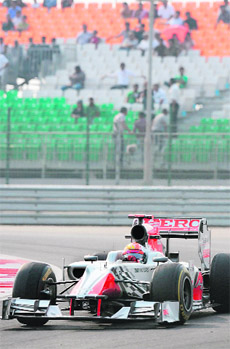 Narain Karthikeyan drives during the first Indian Grand Prix at BIC in Greater Noida. He is not in points contention this year but says he is going to fight it out. 