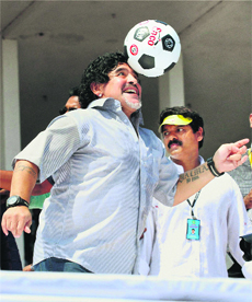 Football legend Diego Armando Maradona displays his skills during a public reception at Jawahar Stadium in Kannur on Wednesday.