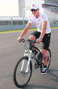 Michael Schumacher cycles at BIC in Greater Noida on Thursday