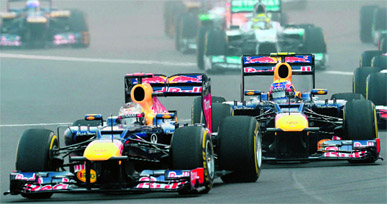 Red Bull�s Sebastian Vettel (front) and Mark Webber led the race right from the begining at BIC on Sunday; victorious Vettel (down) at the podium.