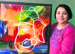 Artist Ritu Taneja with her painting at an exhibition at Gurgaon. A Tribune photograph