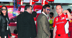 Gagan Narang and Ajay Devgn at the Ferrari paddock at the BIC on Sunday. � PTI