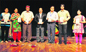 Sunil Mutreja (second from right), Executive Director, Amar Ujala Group, Noida, releases �Sanskriti Ke Prahari�, a book on the life sketch of Anoop Lather (extreme right), Director, Youth and Cultural Affairs, Kurukshetra University.