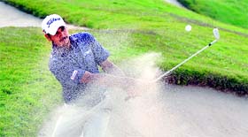 Gaganjeet Bhullar plays from the bunker at the 15th hole in the final round of the tournament on Sunday.