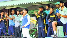 His teammates cheer the feat.