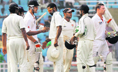 Mumbai A and England players shake hands on the final day of the match. � PTI