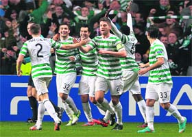 Celtic�s Tony Watt (C) celebrates after scoring during their Champions League Group G win over Barcelona in Glasgow on Wednesday