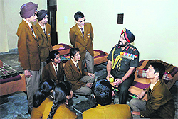 Chief of Army Staff General Bikram Singh with schoolchildren in the room where he used to stay.