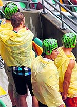Drenched South African fans wait for the play to begin on Day 2 of the first Test