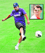 Sachin Tendulkar plays with a soccer ball during a cricket practice session in Ahmedabad. JAMES ANDERSON (inset) � Reuters