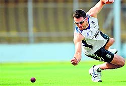 An England player dives for ball during a fielding session