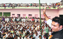 Sirsa MP Ashok Tanwar addresses a meeting on Vishwakarma Day at Bhuna in Fatehabad on Wednesday. A Tribune photograph