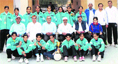 A group photo of women football team of the district with the office-bearers of the District Football Association, sports officials and coaches in Sonepat. Photo: BS Malik