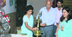 Rajiv Batra lights a lamp as Principal Punam Miglani (left) and Vice-Principal Kavita Batra (right) look on in the MM College of Education at Fatehabad. A Tribune photograph