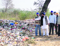 Villagers show the garbage site that is located outside Ropar city on Friday. 