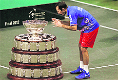 Czech Republic's Radek Stepanek dances around the trophy after winning the Davis Cup final match.