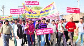 NSS volunteers take out a rally to create awareness about AIDS at Dubaldhan village in Jhajjar