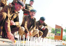 Gurgaon traffic police personnel light candles to pay tributes to road accident victims as they observe World Day of Remembrance for Road Traffic Victims
